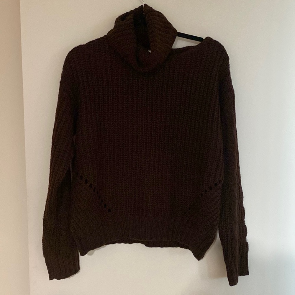 John and Jenn cable knit sweater with shoulder cut out.